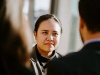 woman looking focused at camera