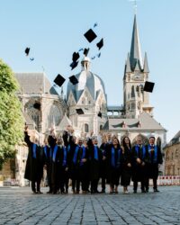 group of graduates throwing their hats